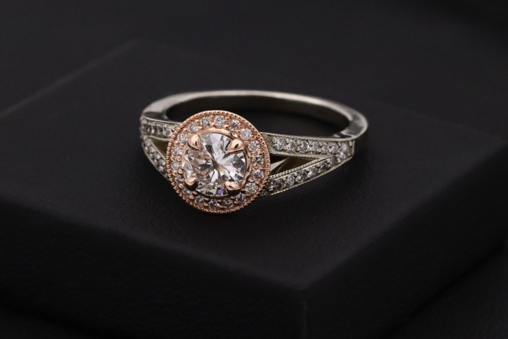engagement diamond gold ring on black background